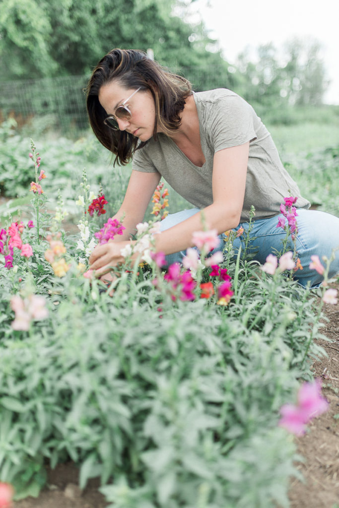 Alix in her garden on our farm. She loves to plant and grow edible flowers. 