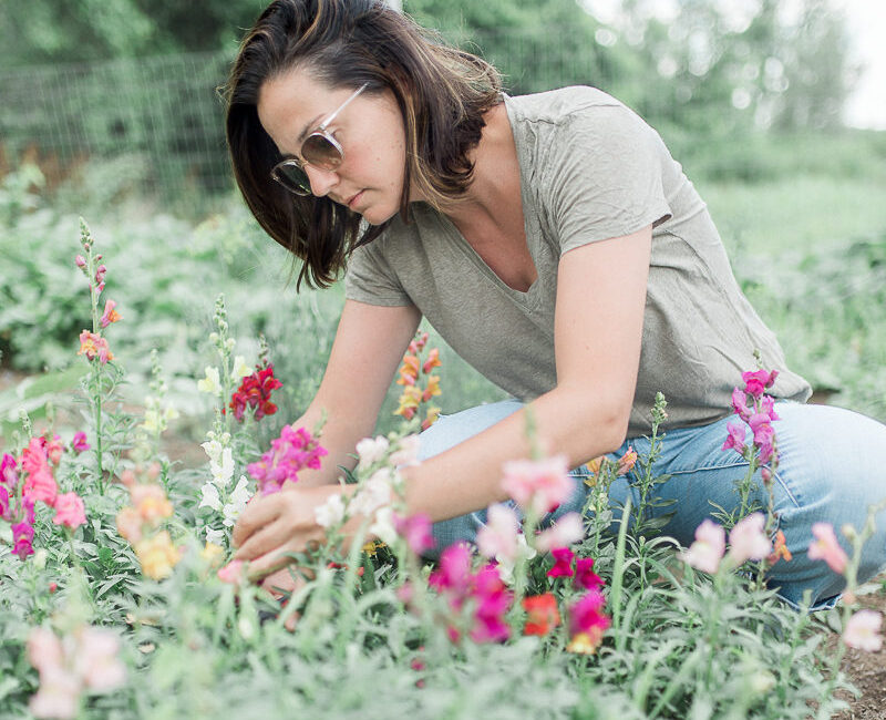 Alix in her garden on our farm. She loves to plant and grow edible flowers.