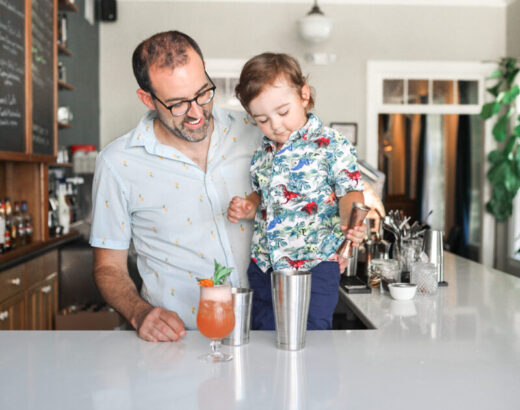 Father and son behind the bar