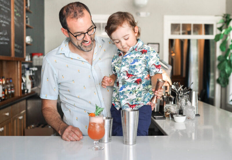 Father and son behind the bar