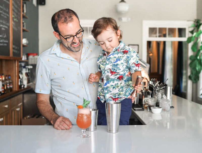 Father and son behind the bar